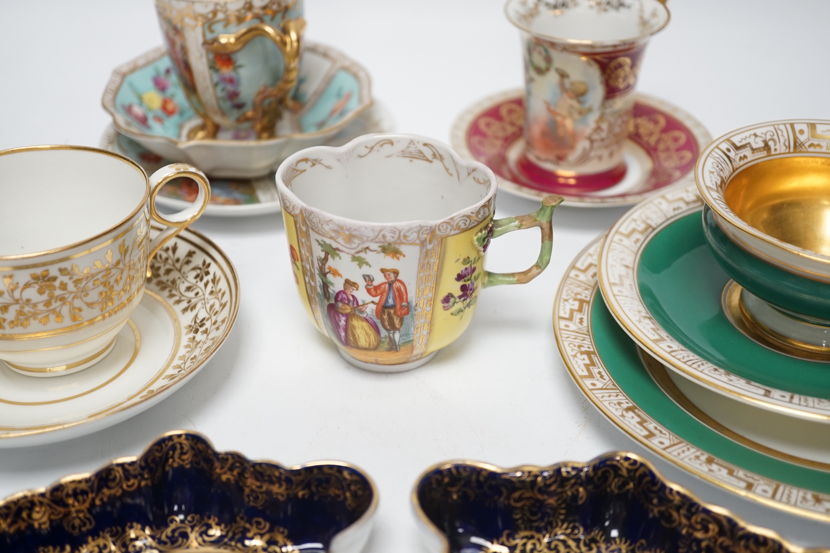 An Austrian chocolate cup and saucer, a similar trio, a BFB Worcester cup and saucer, a pair of spoon trays, etc. , spoon trays 15.5cm wide (14)